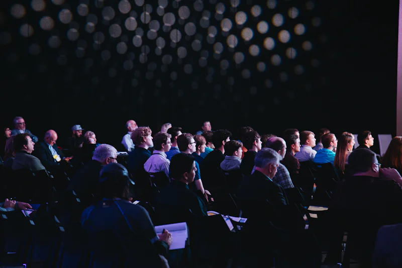 Delegates seated in a conference session